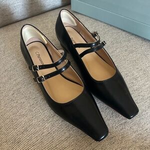 C. Paravano black leather shoes, size 38.5